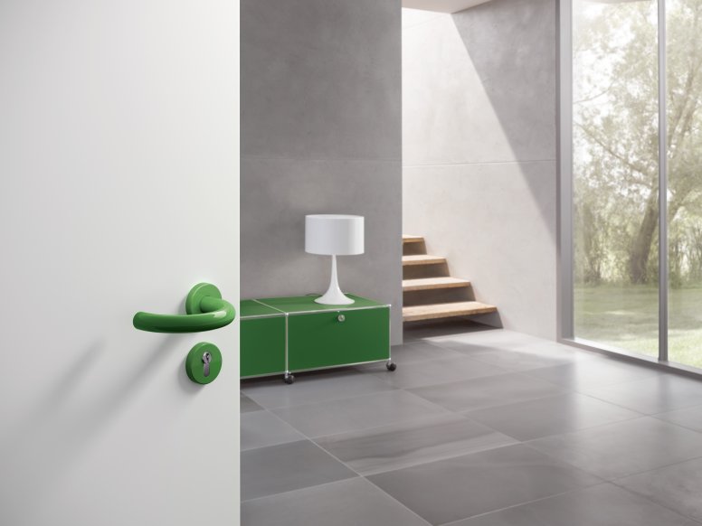 Lever handle with curved U-shape in the color may green made of polyamide