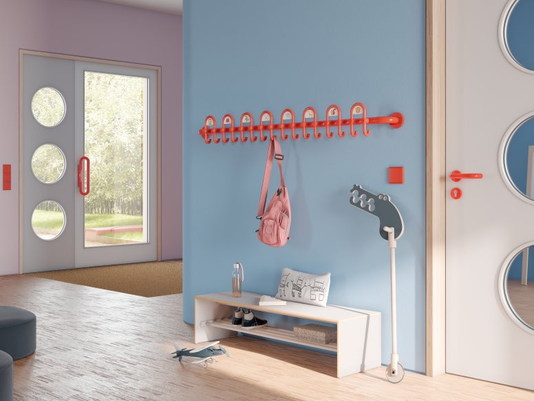 Colorful kindergarten equipped with fittings and wardrobe in the color orange