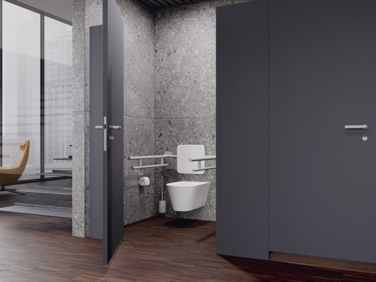 Public WC cubicle with back support and folding support handles in signal white