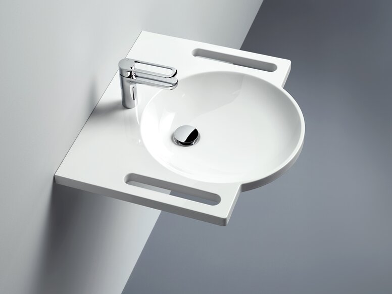 lavabo avec barre d'appui, vasque ronde et robinetterie monocommande en chrome